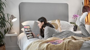 Woman browses the Freeview mobile app
